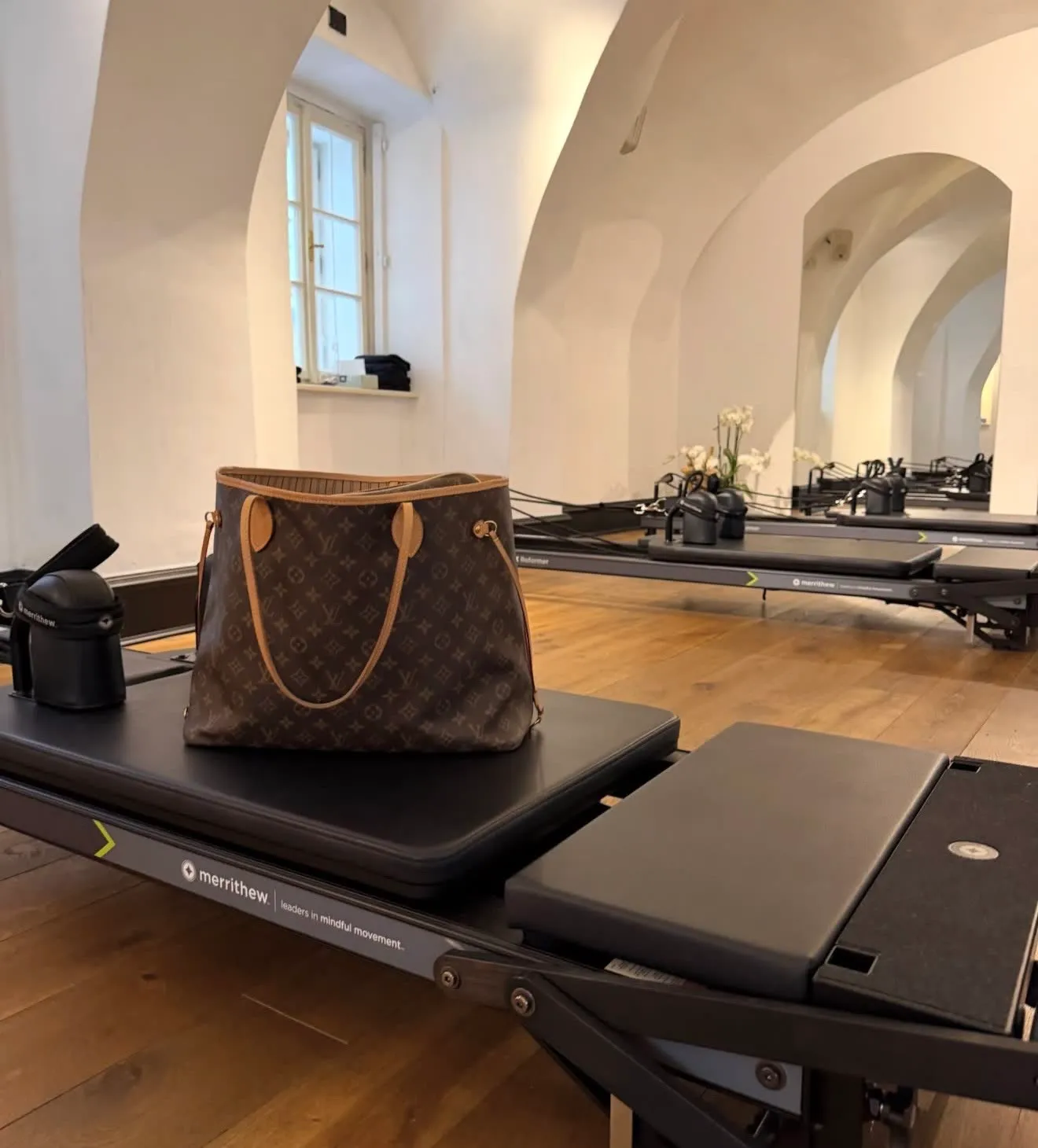 A close-up of a reformer by the window in daylight